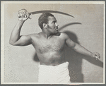 Rex Ingram, shirtless, with cutlass