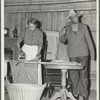 Woman ironing, man talking