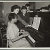 Teacher and student at piano, Jewish Settlement