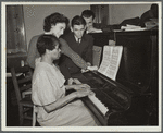 Teacher and student at piano, Jewish Settlement