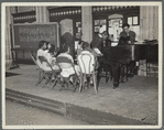 Central Manhattan Music School, students around piano