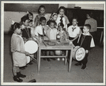 Drum students around a table