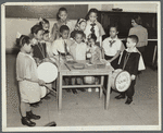 Drum students around a table