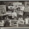 Flatbush art students showing examples of their work