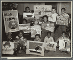 Flatbush art students showing examples of their work