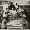 Oliver Harrington supervises class studying mural work, Hudson Ave Boys' Club
