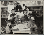 Oliver Harrington supervises class studying mural work, Hudson Ave Boys' Club