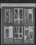 Children in the windows of an abandoned building