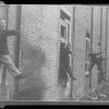Children in the windows of an abandoned building