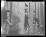 Children in the windows of an abandoned building