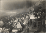 Arturo Toscanini conducting an orchestra