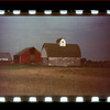 Barns behind a fence