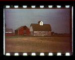 Barns behind a fence