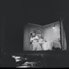 Larry Kert and Carol Lawrence kneeling [embracing] in bedroom scene from the stage production West Side Story