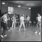 Jerome Robbins and dancers rehearse fight scene for the stage production West Side Story