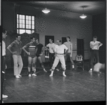 Jerome Robbins and dancers rehearse fight scene for the stage production West Side Story