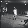 Jerome Robbins (obscured) directs dancers in rehearsal for the stage production West Side Story