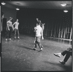 Jerome Robbins (obscured) directs dancers in rehearsal for the stage production West Side Story