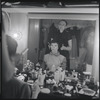 Irene Sharaff and Lee Theodore (a.k.a. Lee Becker) in the dressing room (photographer Martha Swope visible in mirror holding camera) during the stage production West Side Story