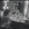 Carol Lawrence applying make-up in the dressing room during the stage production West Side Story