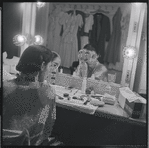 Carol Lawrence applying make-up in the dressing room during the stage production West Side Story