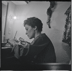 Chita Rivera applying make-up in the dressing room during the stage production West Side Story