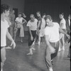 Jerome Robbins directing dancers in rehearsal for the stage production West Side Story