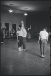 Jerome Robbins directing dancers in rehearsal for the stage production West Side Story