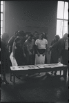 Jean Rosenthal, Irene Sharaff, Arthur Laurents, Leonard Bernstein, Jerome Robbins, Sylvia Drulie, and Robert E. Griffith consulting Sharaff's costume designs during rehearsal for the stage production West Side Story