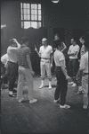 Jerome Robbins directing dancers in rehearsal for the stage production West Side Story