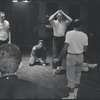 Jerome Robbins directing dancers in rehearsal for the stage production West Side Story