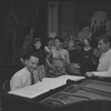 Stephen Sondheim, Leonard Bernstein, and cast around piano in rehearsal for the stage production West Side Story