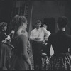 Leonard Bernstein surrounded by cast members during rehearsal for the stage production West Side Story