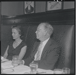 Unidentified woman and Robert E. Griffith at the opening night party at Sardi's for the stage production West Side Story