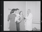 Unidentified actors receiving vaccinations in publicity photograph related to the stage production West Side Story