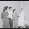 Unidentified actors receiving vaccinations in publicity photograph related to the stage production West Side Story