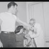 Unidentified actors receiving vaccinations in publicity photograph related to the stage production West Side Story