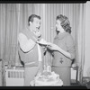 Publicity photographs of actors celebrating backstage the first anniversary for the stage production West Side Story