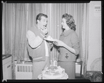 Publicity photographs of actors celebrating backstage the first anniversary for the stage production West Side Story