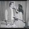 Publicity photographs of actors celebrating backstage the first anniversary for the stage production West Side Story