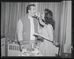 Publicity photographs of actors celebrating backstage the first anniversary for the stage production West Side Story