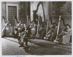 Unidentified man playing cello in a scene from the motion picture Carnegie Hall