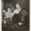 Ora Nichols and Frank Gow (with CBS microphone visible) in the CBS sound effects department performing for the WABC-Columbia network radio program The Ghost of Benjamin Sweet