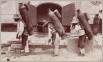 Three men with large water jars on their backs
