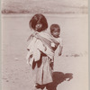 Mexican woman carrying child