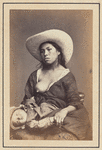 Studio portrait of an unidentified Peruvian woman breastfeeding