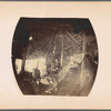 Man inside a thatched roof camp building