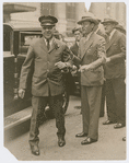 View of James H. Williams, Chief Attendant of the Red Caps at Grand Central Terminal (left) and former New York City Mayor James Walker, in New York City