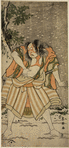 Actor Ichikawa Omezo standing barefoot beside a tree
