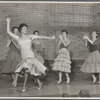 Chita Rivera [foreground] and Shark girls perform "America" in the stage production West Side Story
